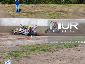 Wilfred Detz and Britget Portijk of the Netherlands come to grief in the Sidecar Support Class during the FIM Long Track World Championship...