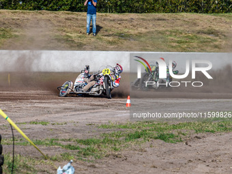 Wilfred Detz and Britget Portijk of the Netherlands come to grief in the Sidecar Support Class during the FIM Long Track World Championship...