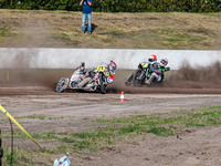 Wilfred Detz and Britget Portijk of the Netherlands come to grief in the Sidecar Support Class during the FIM Long Track World Championship...