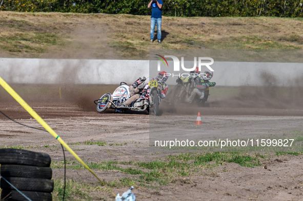 Wilfred Detz and Britget Portijk of the Netherlands come to grief in the Sidecar Support Class during the FIM Long Track World Championship...