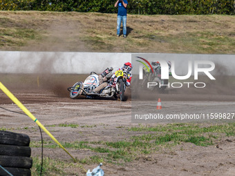 Wilfred Detz and Britget Portijk of the Netherlands come to grief in the Sidecar Support Class during the FIM Long Track World Championship...