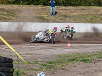 Wilfred Detz and Britget Portijk of the Netherlands come to grief in the Sidecar Support Class during the FIM Long Track World Championship...