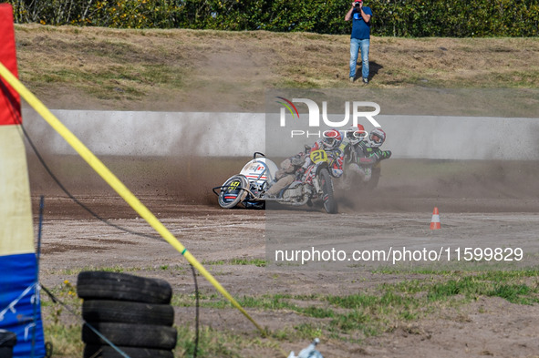 Wilfred Detz and Britget Portijk of the Netherlands come to grief in the Sidecar Support Class during the FIM Long Track World Championship...