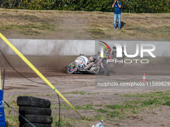 Wilfred Detz and Britget Portijk of the Netherlands come to grief in the Sidecar Support Class during the FIM Long Track World Championship...