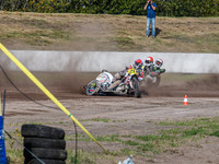 Wilfred Detz and Britget Portijk of the Netherlands come to grief in the Sidecar Support Class during the FIM Long Track World Championship...