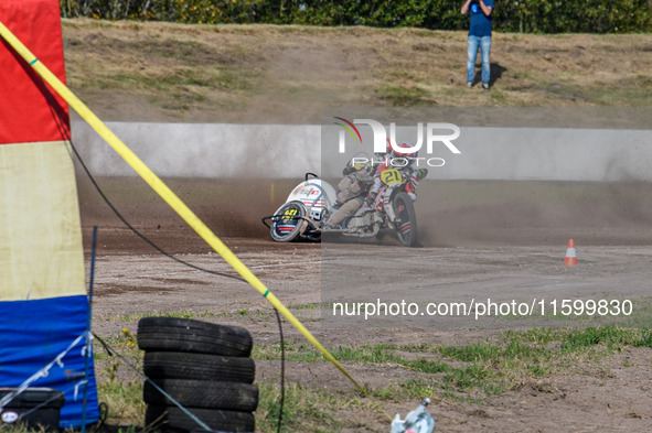 Wilfred Detz and Britget Portijk of the Netherlands come to grief in the Sidecar Support Class during the FIM Long Track World Championship...