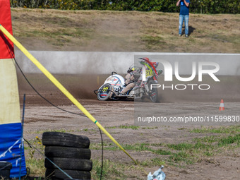 Wilfred Detz and Britget Portijk of the Netherlands come to grief in the Sidecar Support Class during the FIM Long Track World Championship...