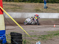 Wilfred Detz and Britget Portijk of the Netherlands come to grief in the Sidecar Support Class during the FIM Long Track World Championship...