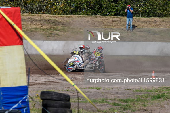 Wilfred Detz and Britget Portijk of the Netherlands come to grief in the Sidecar Support Class during the FIM Long Track World Championship...