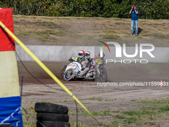 Wilfred Detz and Britget Portijk of the Netherlands come to grief in the Sidecar Support Class during the FIM Long Track World Championship...