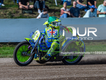 Mitch Goddard and Paul Smith (9) of Great Britain look for the chasing pack during the FIM Long Track World Championship Final 5 at the Spee...