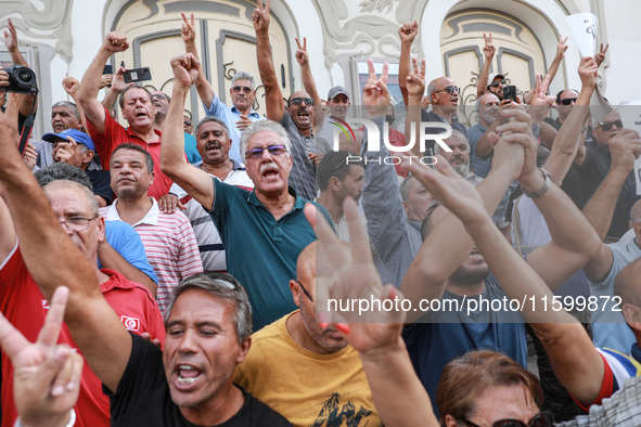 Demonstrators shout slogans against Tunisian president Kais Saied as they wave their arms during a demonstration organized by the Tunisian N...