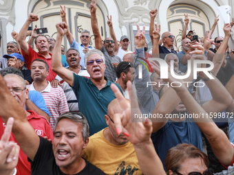 Demonstrators shout slogans against Tunisian president Kais Saied as they wave their arms during a demonstration organized by the Tunisian N...