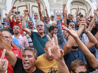 Demonstrators shout slogans against Tunisian president Kais Saied as they wave their arms during a demonstration organized by the Tunisian N...