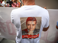 A demonstrator wearing a T-shirt with a photo of jailed presidential candidate Ayachi Zammel attends a demonstration organized by the Tunisi...