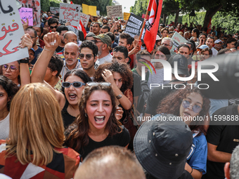 Young female demonstrators shout slogans during a demonstration organized by the Tunisian Network for Rights and Freedoms in Tunis, Tunisia,...