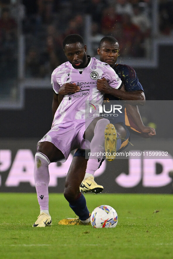 Keinan Davis of Udinese Calcio and Evan Ndicka of A.S. Roma are in action during the 5th day of the Serie A Championship between A.S. Roma a...