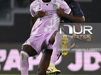 Keinan Davis of Udinese Calcio and Evan Ndicka of A.S. Roma are in action during the 5th day of the Serie A Championship between A.S. Roma a...