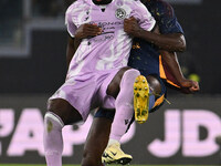 Keinan Davis of Udinese Calcio and Evan Ndicka of A.S. Roma are in action during the 5th day of the Serie A Championship between A.S. Roma a...