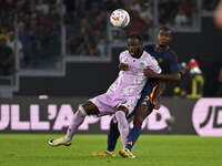 Keinan Davis of Udinese Calcio and Evan Ndicka of A.S. Roma are in action during the 5th day of the Serie A Championship between A.S. Roma a...