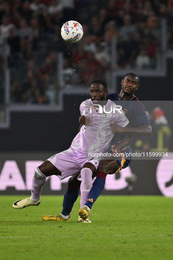 Keinan Davis of Udinese Calcio and Evan Ndicka of A.S. Roma are in action during the 5th day of the Serie A Championship between A.S. Roma a...