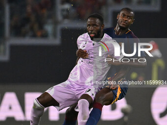 Keinan Davis of Udinese Calcio and Evan Ndicka of A.S. Roma are in action during the 5th day of the Serie A Championship between A.S. Roma a...