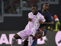 Keinan Davis of Udinese Calcio and Evan Ndicka of A.S. Roma are in action during the 5th day of the Serie A Championship between A.S. Roma a...