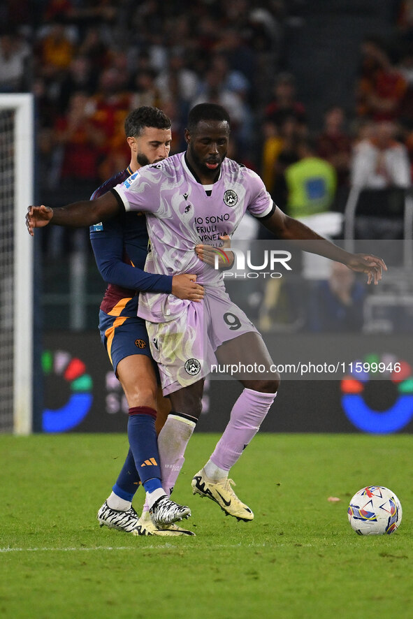 Mario Hermoso of A.S. Roma and Keinan Davis of Udinese Calcio are in action during the 5th day of the Serie A Championship between A.S. Roma...