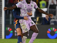 Mario Hermoso of A.S. Roma and Keinan Davis of Udinese Calcio are in action during the 5th day of the Serie A Championship between A.S. Roma...