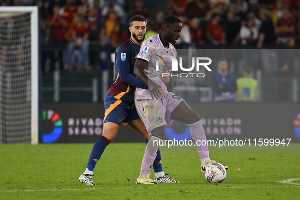 Mario Hermoso of A.S. Roma and Keinan Davis of Udinese Calcio are in action during the 5th day of the Serie A Championship between A.S. Roma...