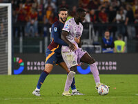 Mario Hermoso of A.S. Roma and Keinan Davis of Udinese Calcio are in action during the 5th day of the Serie A Championship between A.S. Roma...