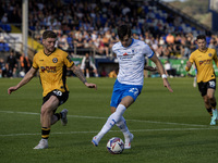 Barrow's Chris Popov is in action with Newport County's Cameron Evans during the Sky Bet League 2 match between Barrow and Newport County at...