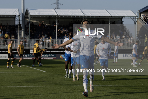 Theo Vassell celebrates after scoring Barrow's second goal during the Sky Bet League 2 match between Barrow and Newport County at Holker Str...