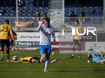 Elliot Newby of Barrow celebrates after scoring their first goal during the Sky Bet League 2 match between Barrow and Newport County at Holk...