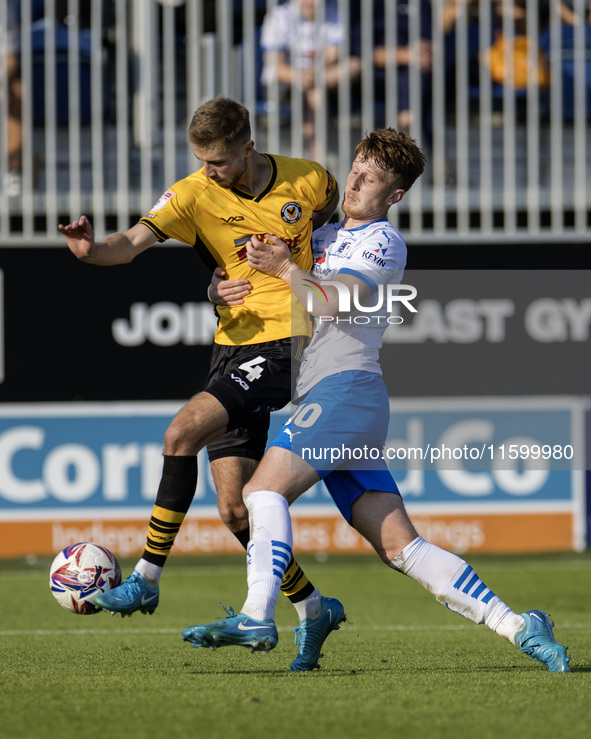 Barrow's Ged Garner battles with Newport County's Matt Baker during the Sky Bet League 2 match between Barrow and Newport County at Holker S...