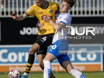 Barrow's Ged Garner battles with Newport County's Matt Baker during the Sky Bet League 2 match between Barrow and Newport County at Holker S...