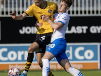 Barrow's Ged Garner battles with Newport County's Matt Baker during the Sky Bet League 2 match between Barrow and Newport County at Holker S...