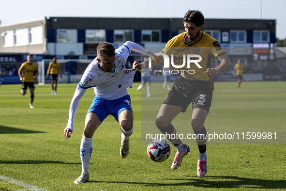 Elliot Newby of Barrow battles with Anthony Glennon of Newport County during the Sky Bet League 2 match between Barrow and Newport County at...