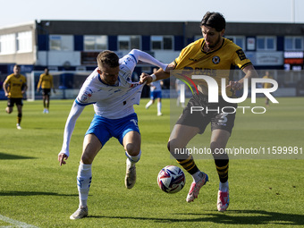 Elliot Newby of Barrow battles with Anthony Glennon of Newport County during the Sky Bet League 2 match between Barrow and Newport County at...