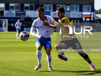 Elliot Newby of Barrow battles with Anthony Glennon of Newport County during the Sky Bet League 2 match between Barrow and Newport County at...