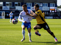 Elliot Newby of Barrow battles with Anthony Glennon of Newport County during the Sky Bet League 2 match between Barrow and Newport County at...