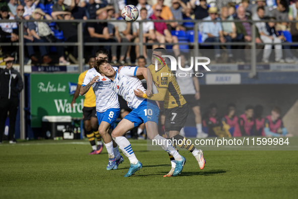 Barrow's Ged Garner battles for possession with Newport County's Kieron Evans during the Sky Bet League 2 match between Barrow and Newport C...