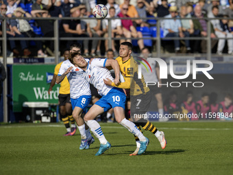 Barrow's Ged Garner battles for possession with Newport County's Kieron Evans during the Sky Bet League 2 match between Barrow and Newport C...