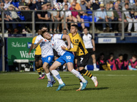 Barrow's Ged Garner battles for possession with Newport County's Kieron Evans during the Sky Bet League 2 match between Barrow and Newport C...