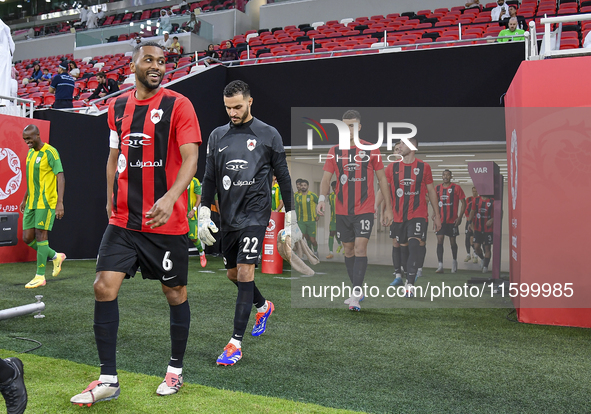 Al Rayyan SC and Al Wakrah SC players walk onto the pitch before the Ooredoo Qatar Stars League 24/25 match between Al Rayyan SC and Al Wakr...