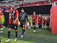 Al Rayyan SC and Al Wakrah SC players walk onto the pitch before the Ooredoo Qatar Stars League 24/25 match between Al Rayyan SC and Al Wakr...