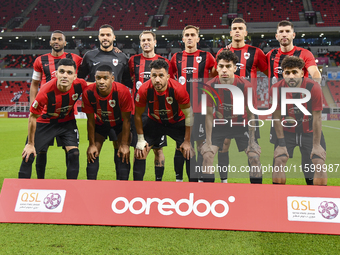 Al Rayyan SC players pose for a team photo before the Ooredoo Qatar Stars League 24/25 match between Al Rayyan SC and Al Wakrah SC at Ahmad...