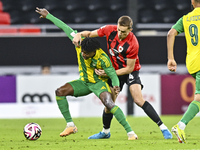 Jacinto Dala (L) of Al Wakrah SC battles for the ball with Gabriel Julien De Sart of Al Rayyan SC during the Ooredoo Qatar Stars League 24/2...