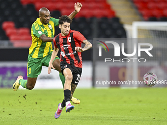 Abdelkarim Hassan of Al Wakrah SC battles for the ball with Gabriel Pereira of Al Rayyan SC during the Ooredoo Qatar Stars League 24/25 matc...