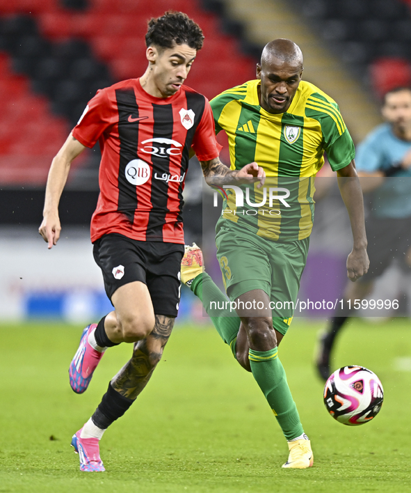 Abdelkarim Hassan (R) of Al Wakrah SC battles for the ball with Gabriel Pereira of Al Rayyan SC during the Ooredoo Qatar Stars League 24/25...